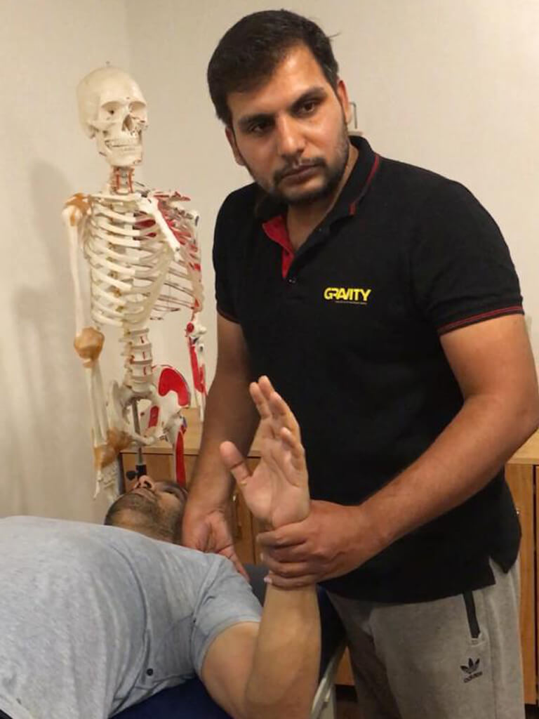 gnanavel performing shoulder physio treatment
